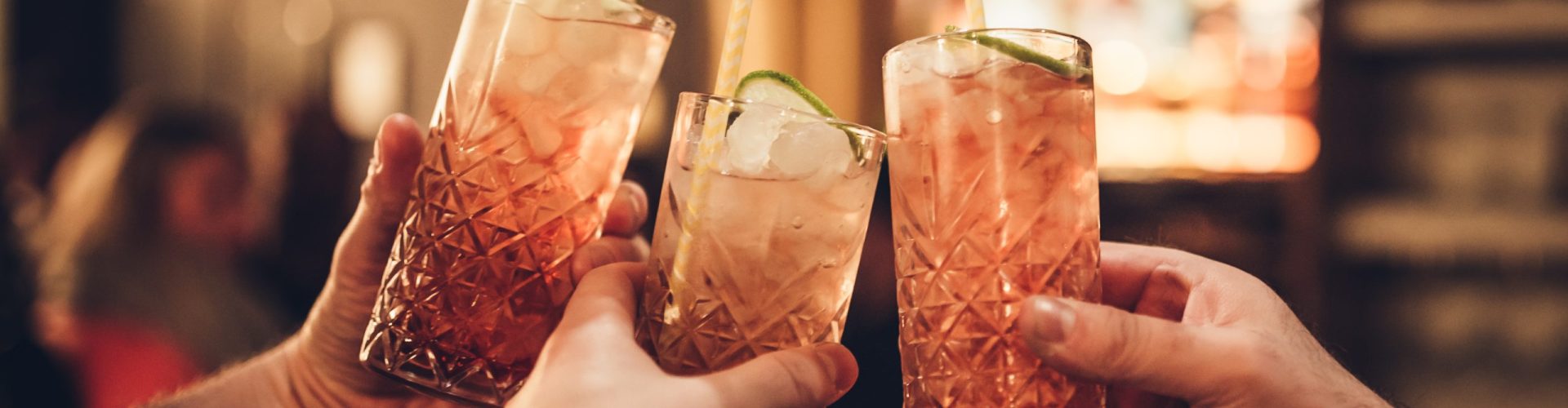 Three,Male,Hands,Holding,Three,Cocktail,Glasses,Againt,Blurred,Background